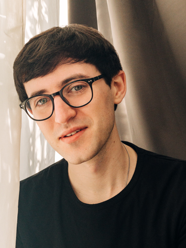 Photo portrait of Matthew, looking thoughtful as he looks at the reader.