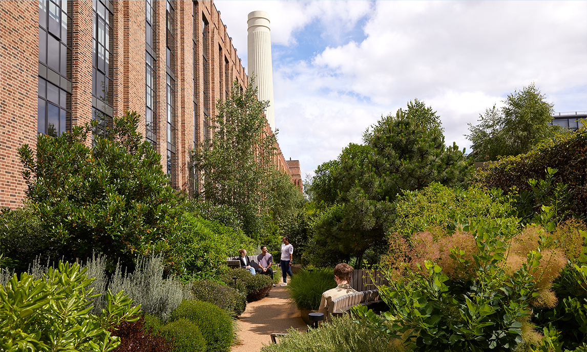 Apple team members strolling through Battersea’s garden terrace.