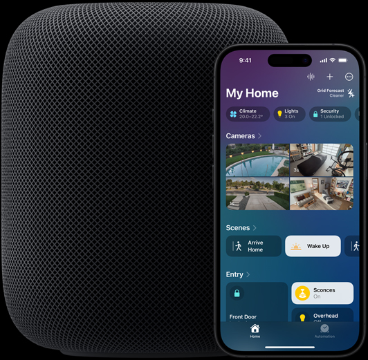 An iPhone — featuring the Home app home screen — is placed slightly in front of a HomePod speaker