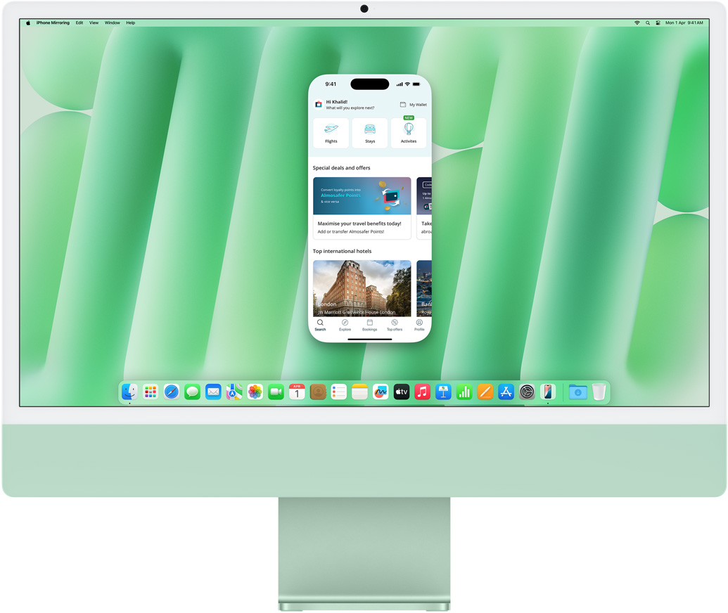 iPhone Mirroring feature demonstration. iPhone screen displaying Uber Eats app mirrored and controlled on iMac.