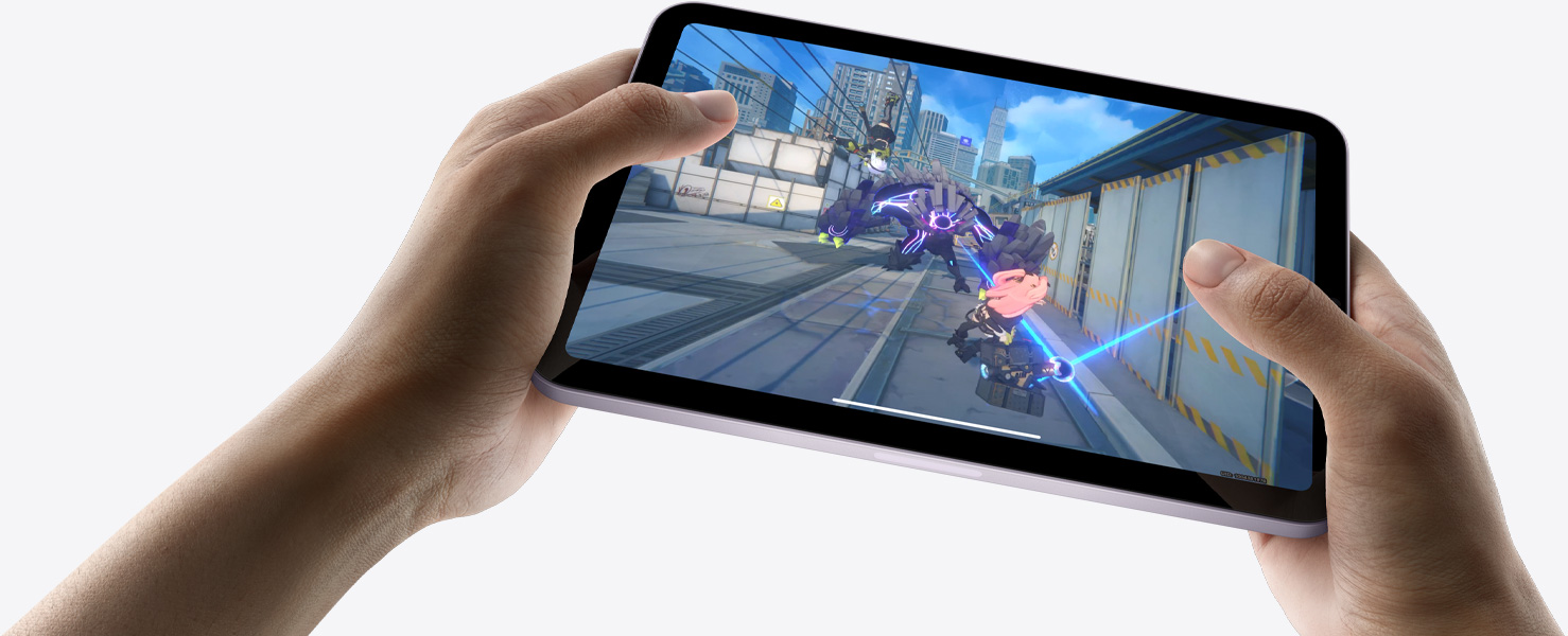 iPad mini held by a user's hands in landscape view playing a graphically intense game.