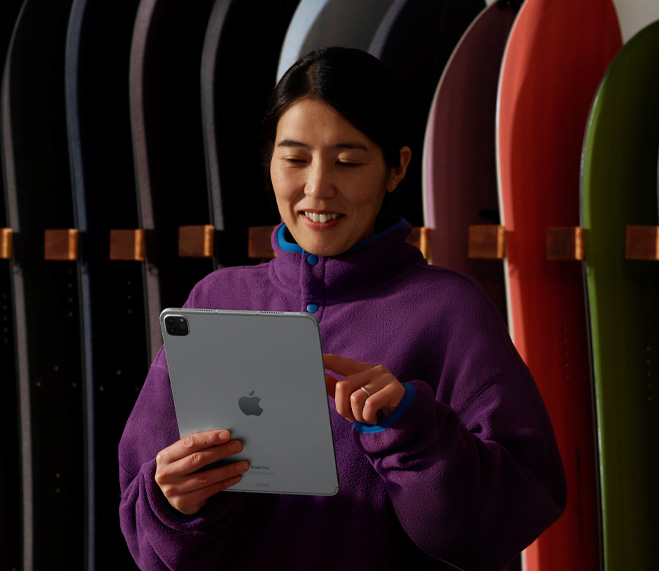 Small business owner takes inventory on iPad.