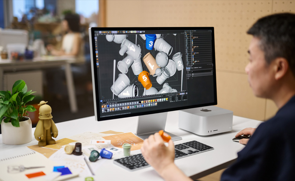 A designer uses Mac for 3D rendering.