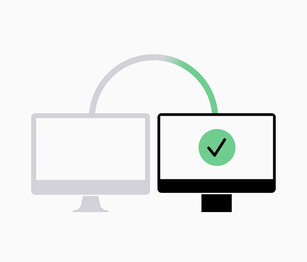 Diagram showing a data transfer from greyed-out computer to a new computer.