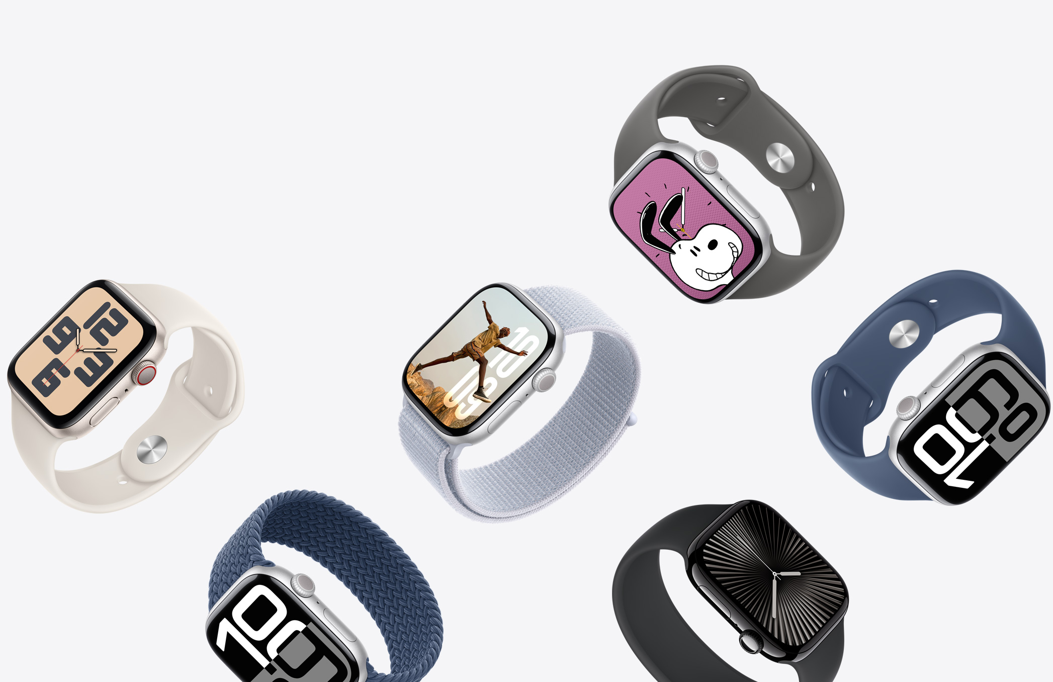 A selection of Apple Watch devices with different case finishes and a variety of band colours and materials.